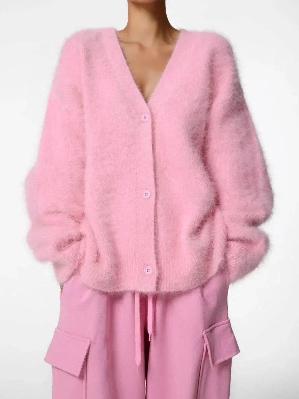 Seasonally versatile cardigan in soft fabric, ideal for layering during fall.