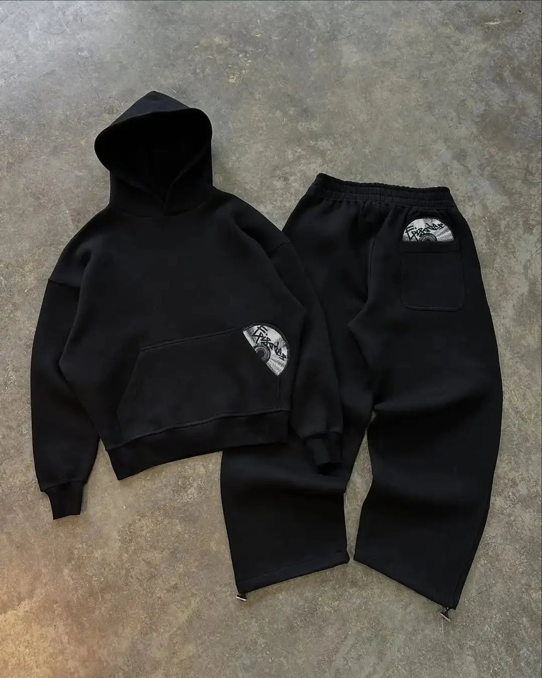 Urban Pulse Tracksuit displayed on hanger, highlighting its versatility for casual and urban settings.
