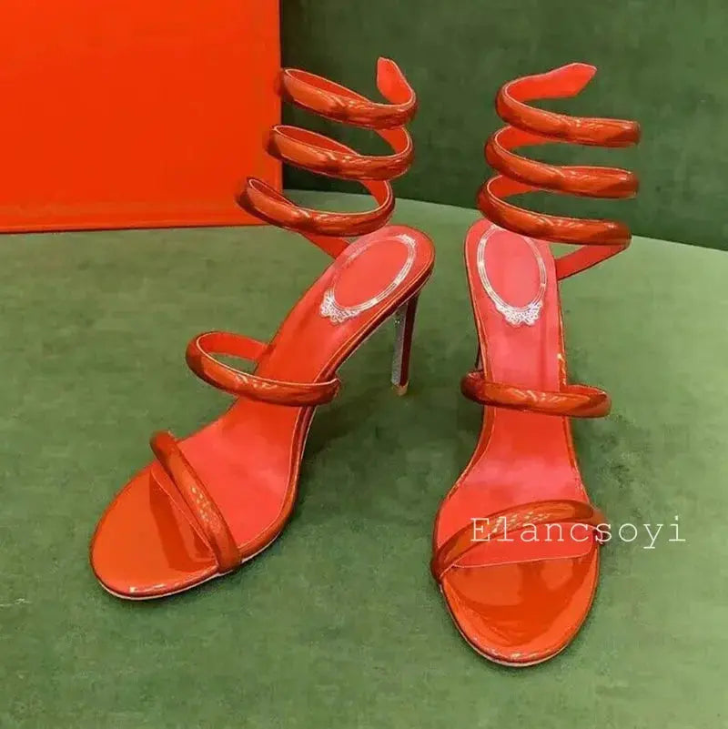Serpentine Elegance Heels paired with a stylish evening dress.