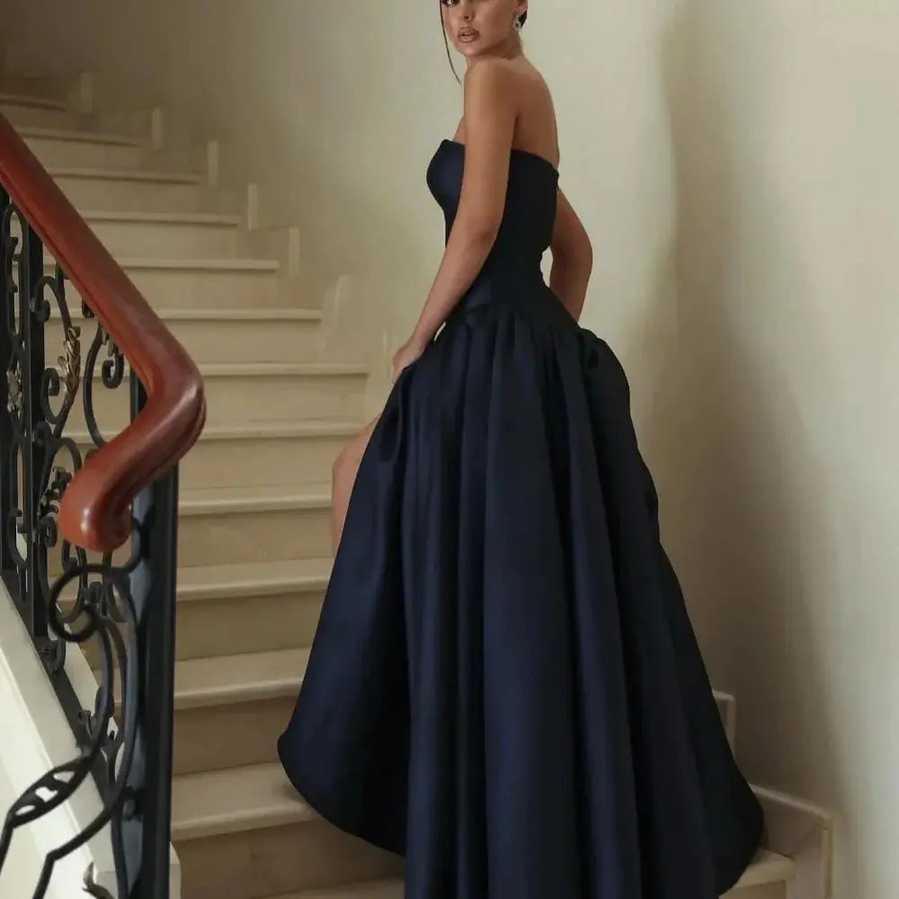 Back view of the elegant satin evening gown, showcasing its graceful floor-length silhouette.