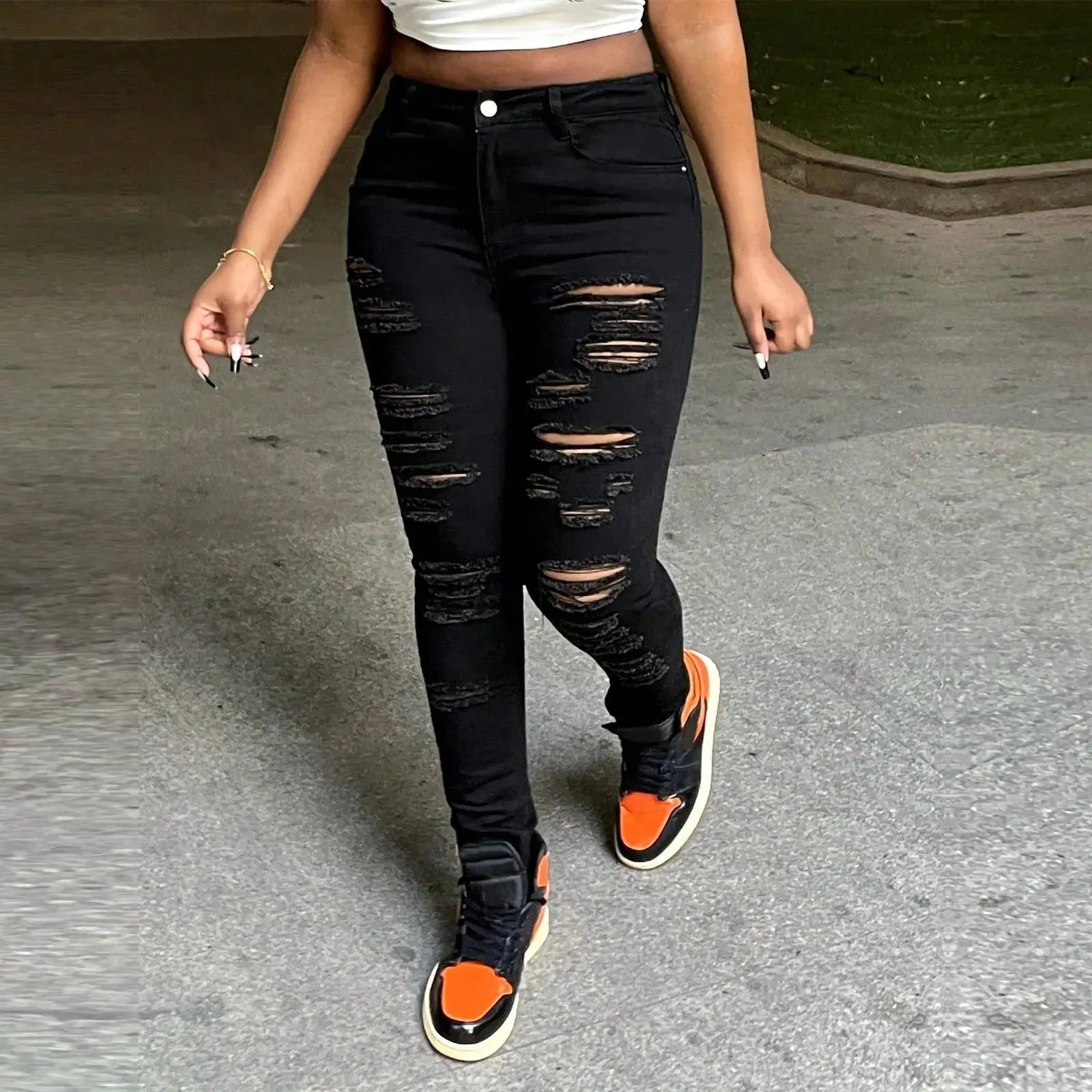 Fabric close-up of four-way stretch black denim showing cotton polyester spandex blend quality and flexibility