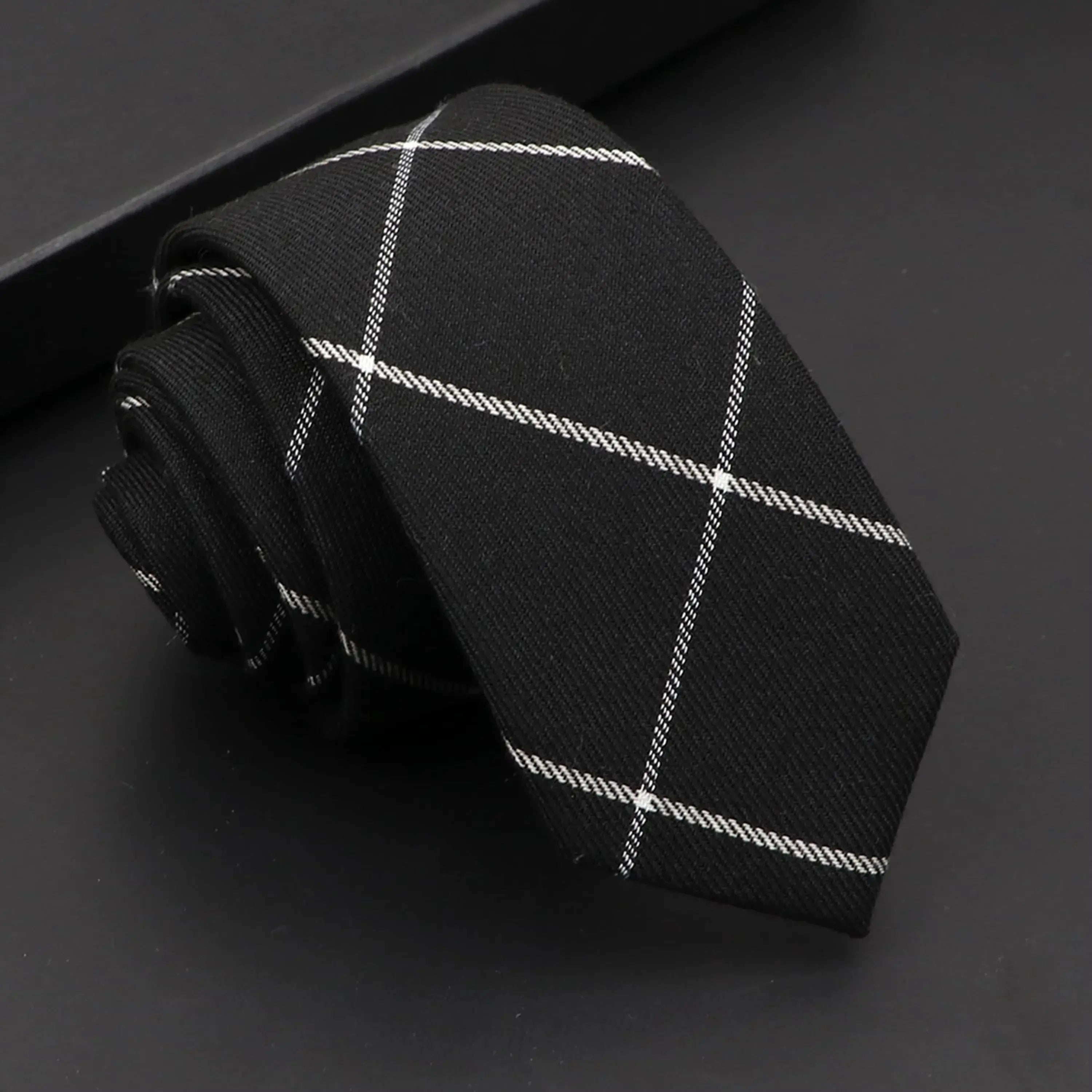 Contemporary black tie, 6cm width, enhances any formal outfit effortlessly.