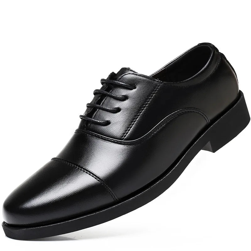 Pointed toe black oxfords showcasing a polished finish for discerning gentlemen.