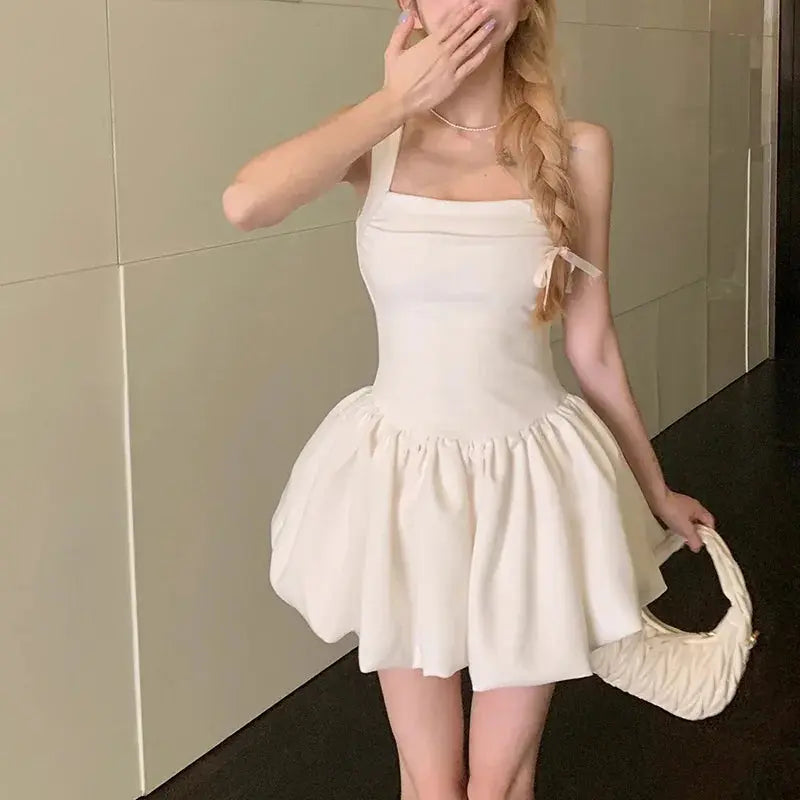 Stylish summer outfit featuring the ruched mini dress with playful hem.
