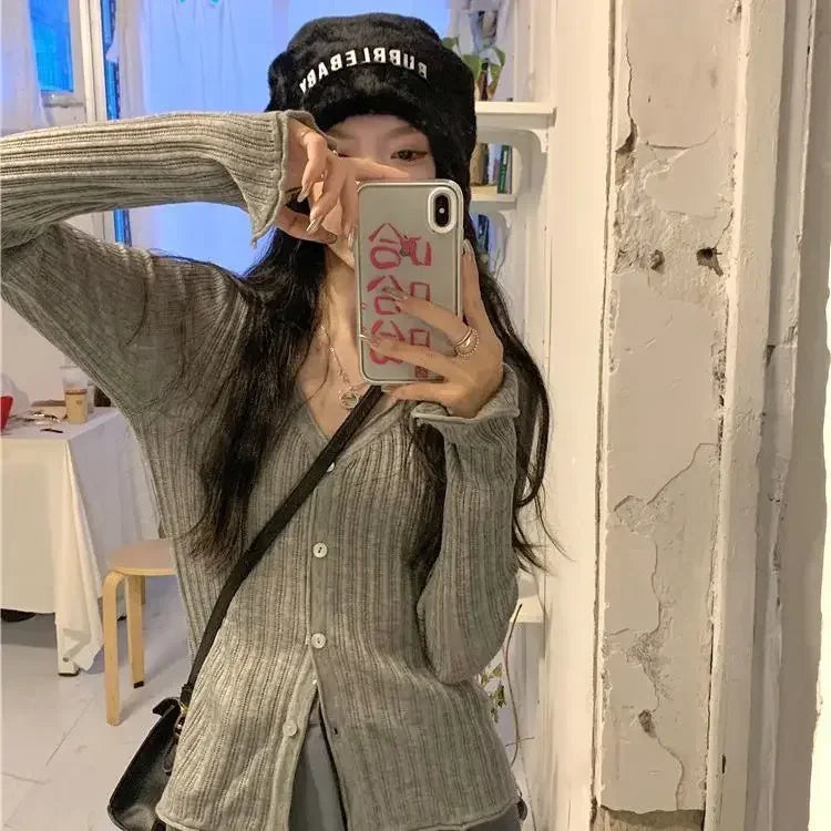 Model pairing the Autumn Whisper Cardigan with fall accessories for a sophisticated look.