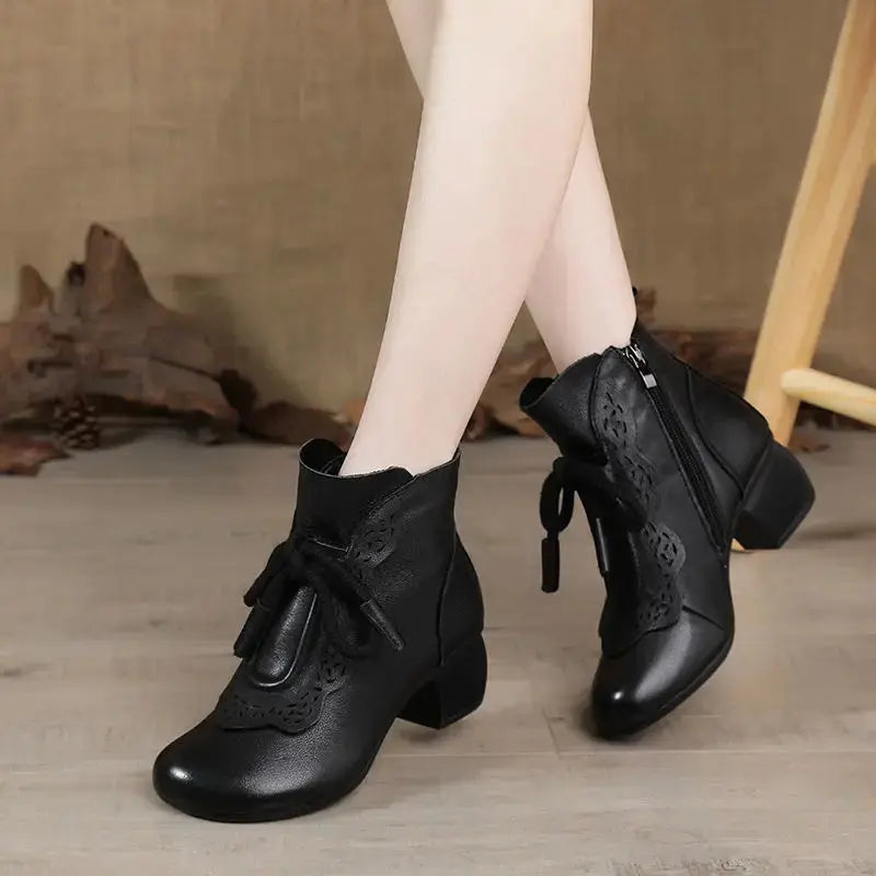 Side view of stylish women's Winter Whispers ankle boots in dark brown.