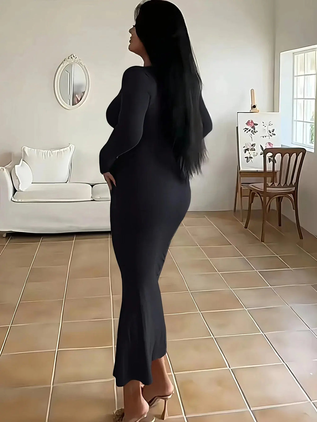 Model wearing the Midnight Whisper fishtail dress, emphasizing the floor-grazing hem and sophisticated style.