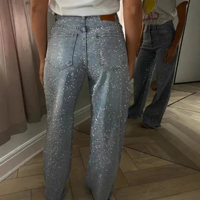 Close-up of high-waist radiance jeans showcasing light-catching details.