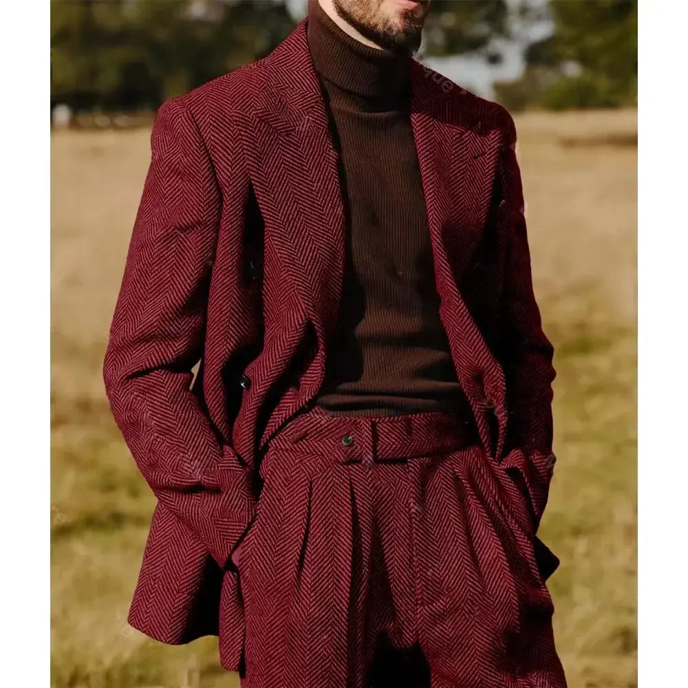 Double-breasted herringbone suit styled with accessories for a formal event.