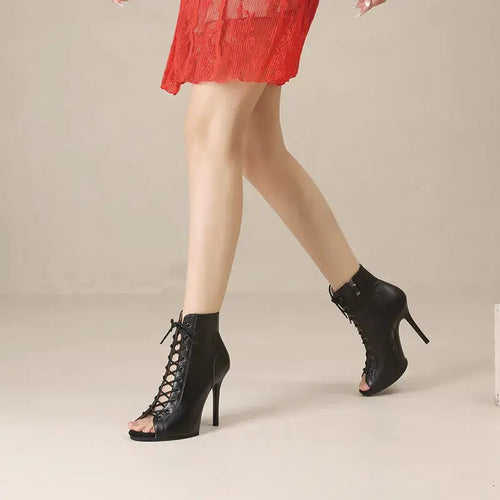 Black high-heel dance boots with peep-toe design and zip closure.
