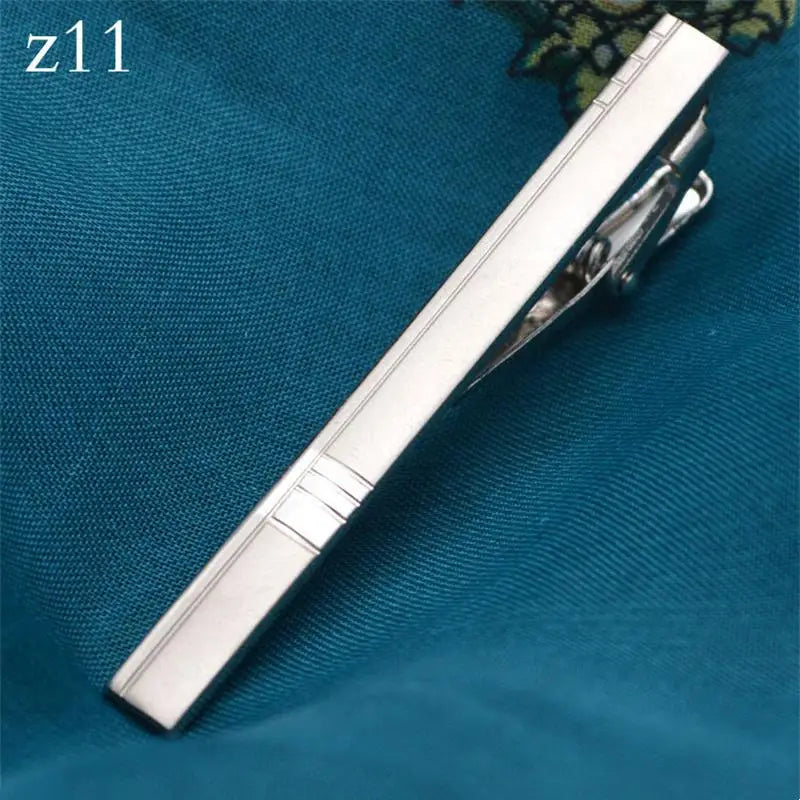 Rose gold tie clip, a refined touch for men's fashion.