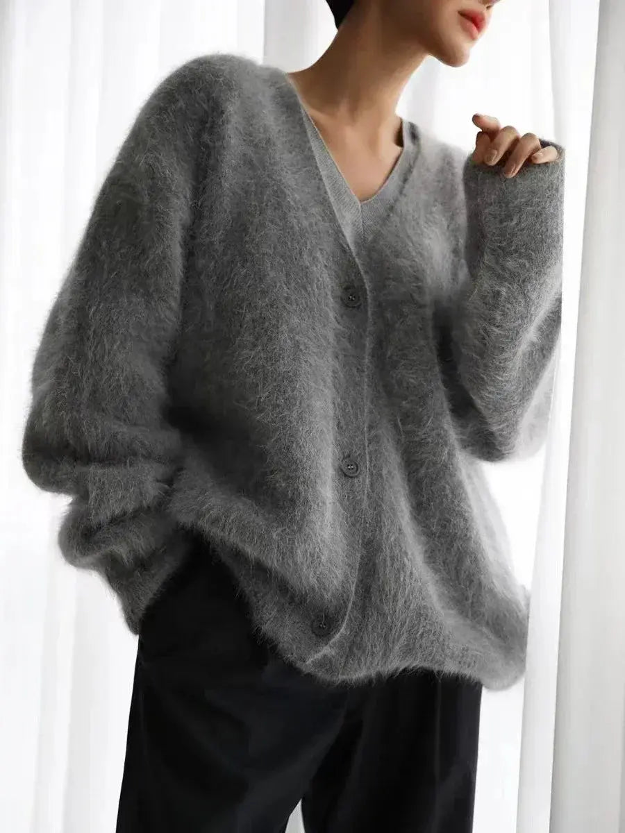 Luxurious beige cardigan with gentle fabric, designed for comfort and style.