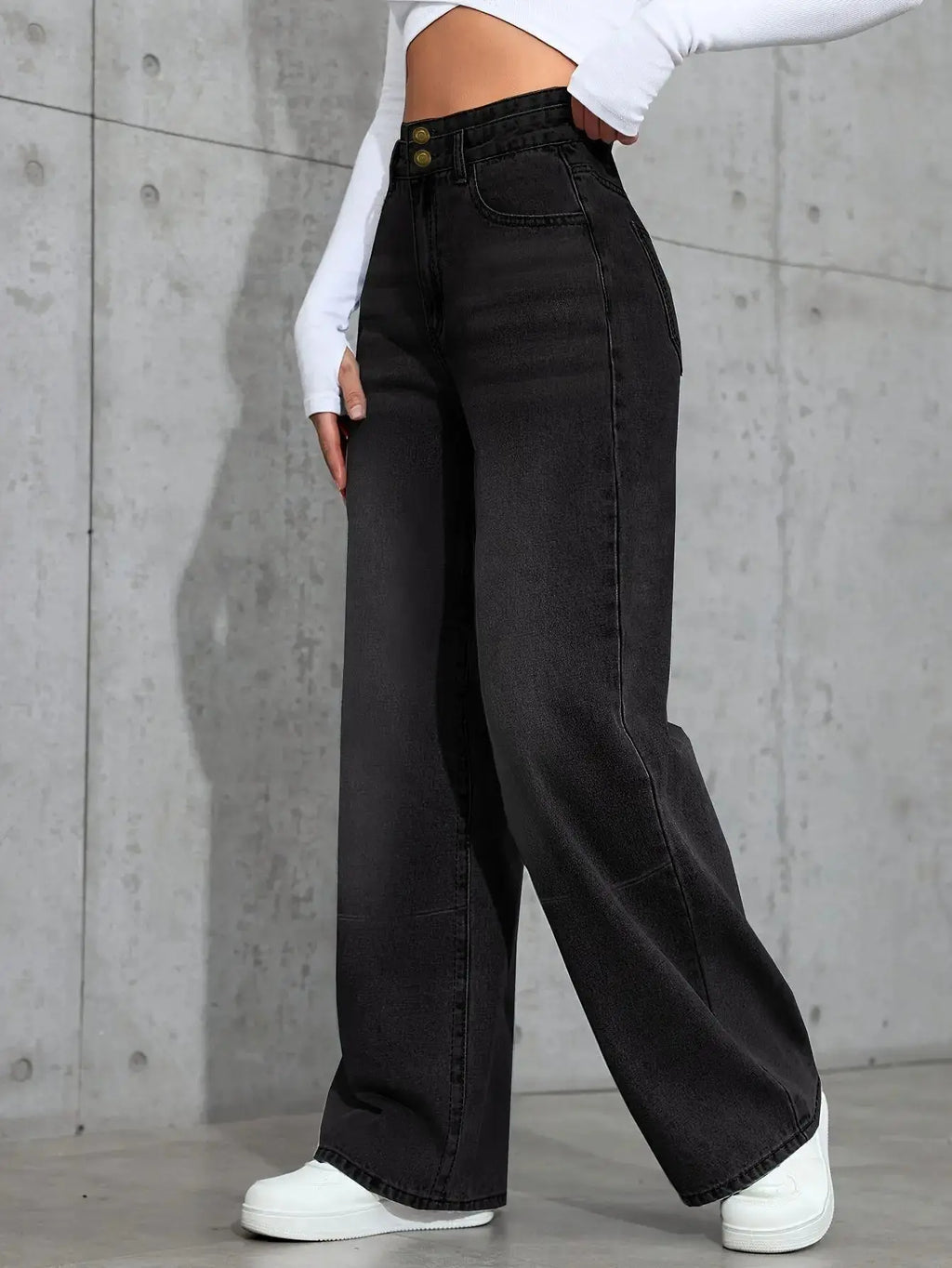 High-waist jeans displayed on a hanger, emphasizing the cotton blend material for all-season wear.