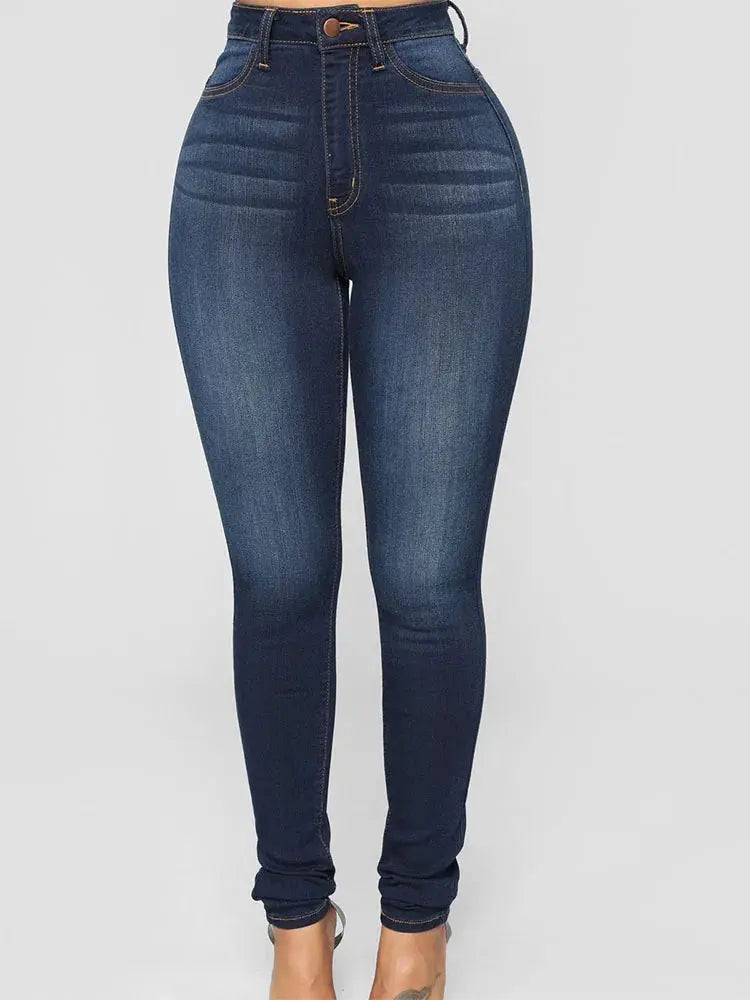 Flat lay of Denim Delight jeans with casual accessories for versatile styling.