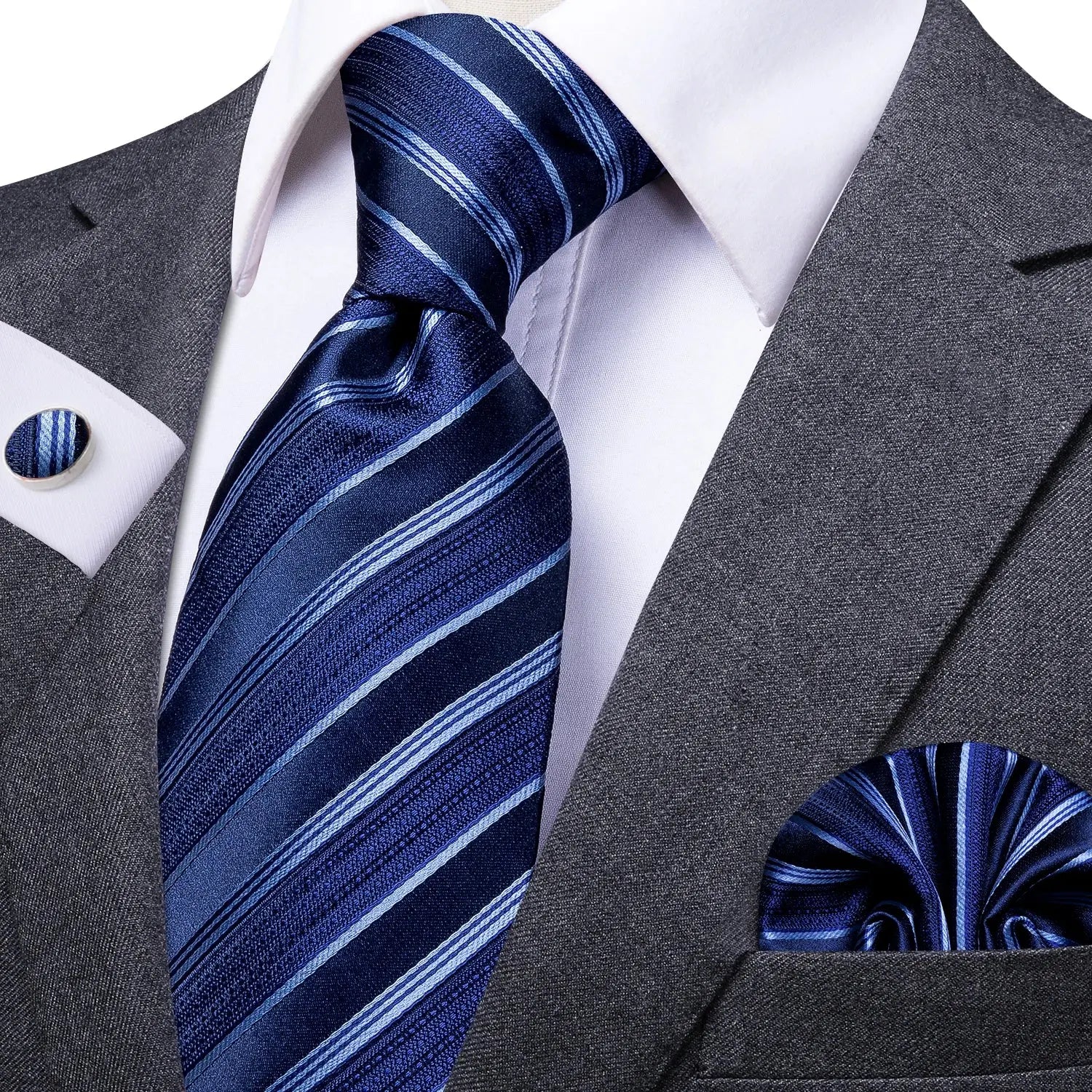 Luxury silk tie set displayed on a wooden surface, highlighting its smooth texture.