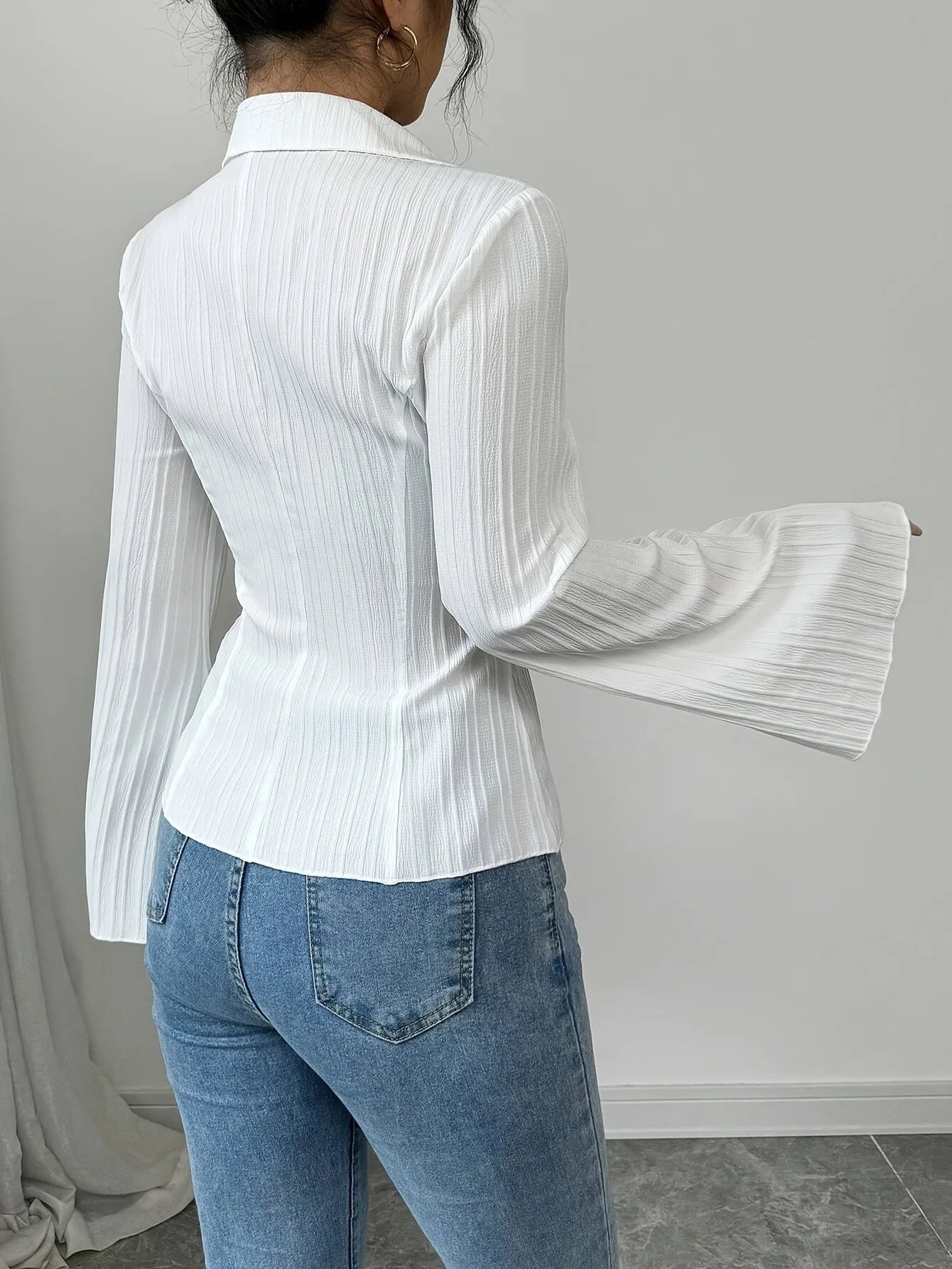 Versatile ribbed peplum top perfect for spring and fall layering with refined silhouette