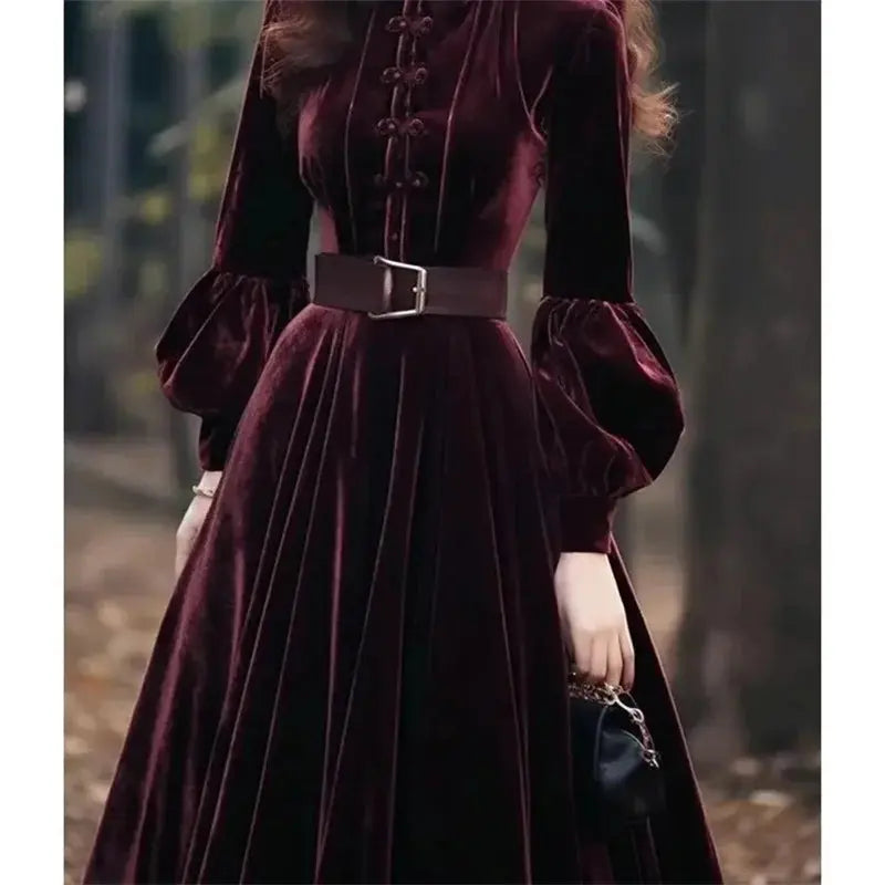 Close-up of the ruffled neckline on the Midnight Whispers Velvet Dress, adding a romantic touch.