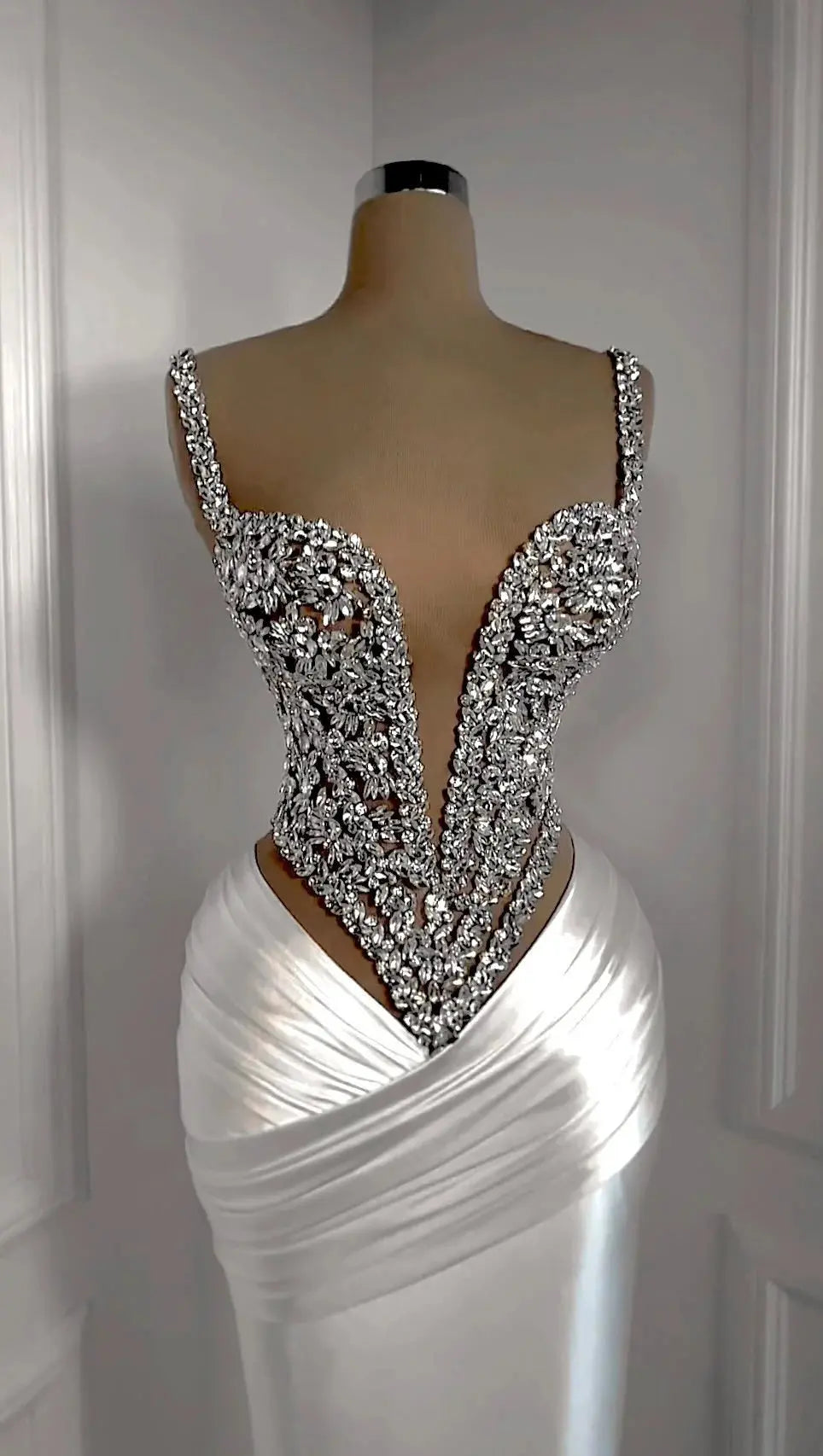 Close-up of hand-applied rhinestones on the Rhinestone Gala Gown, sparkling under light.