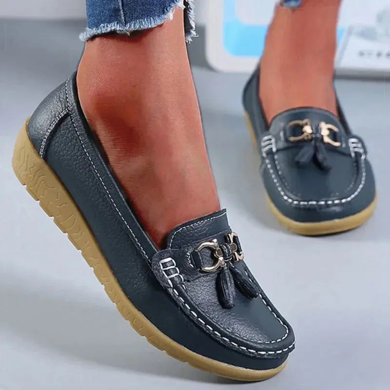 Minimalist design white slip-on shoes perfect for casual outfits.
