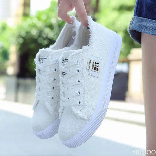 Close-up of breathable canvas upper in navy, designed for comfort and style.