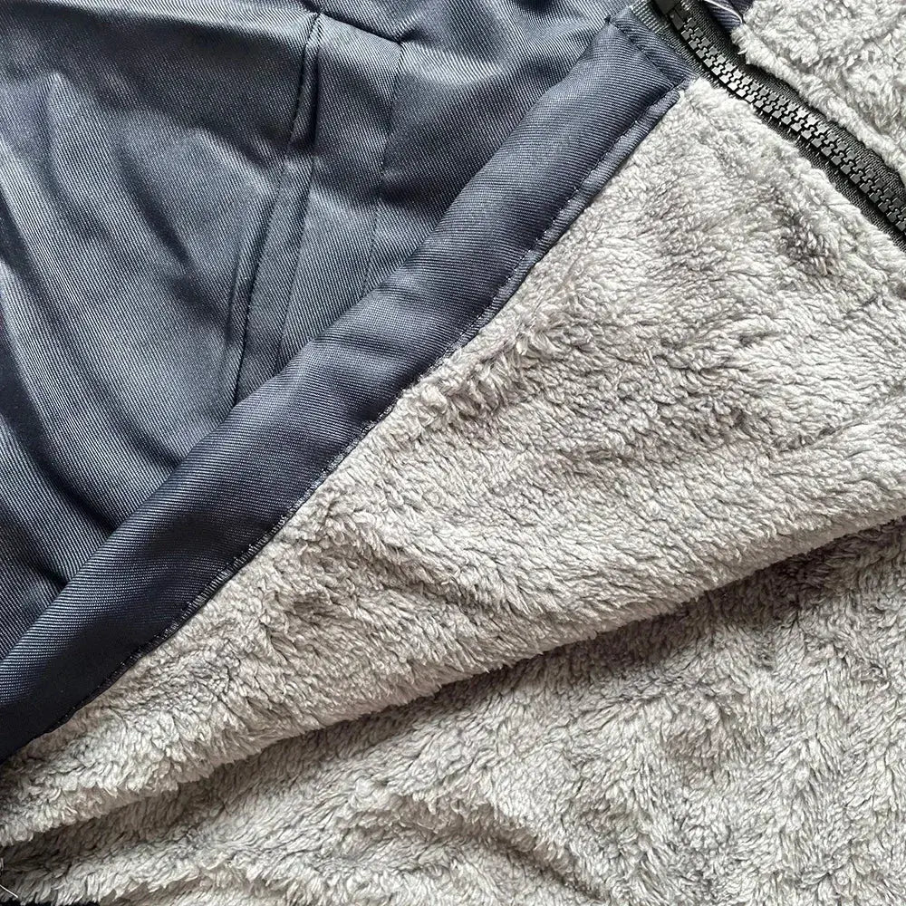 Close-up of intricate geometric tribal print design on fleece-lined hooded cardigan