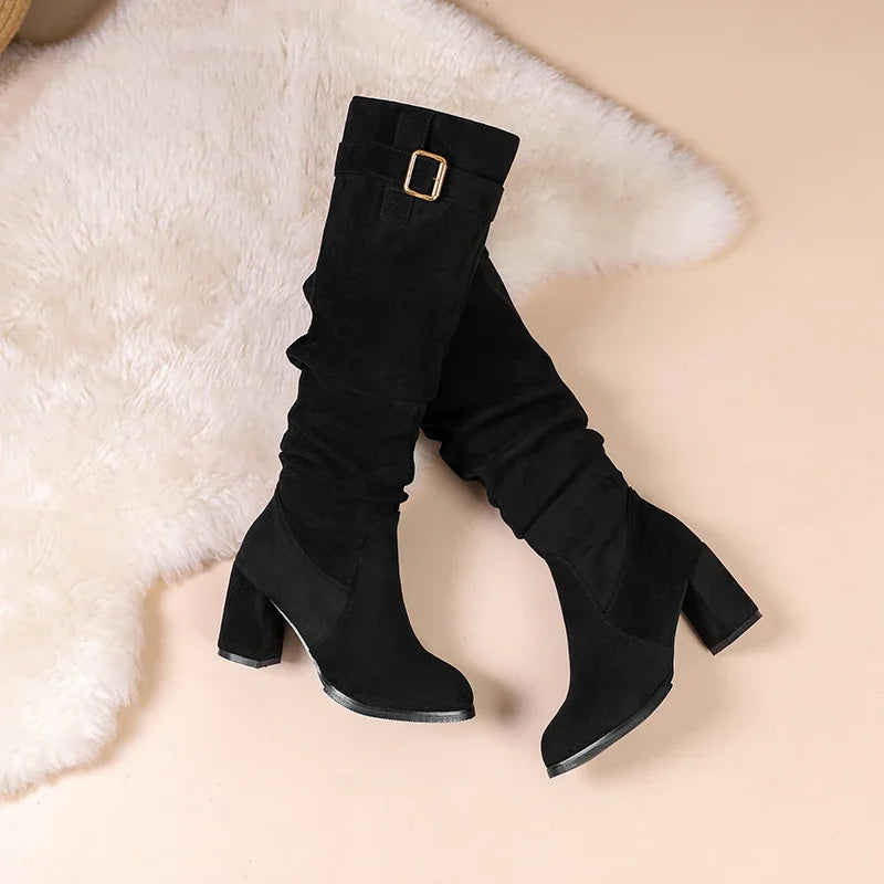 Slip-on suede boots featuring waterproof protection and comfortable square heel