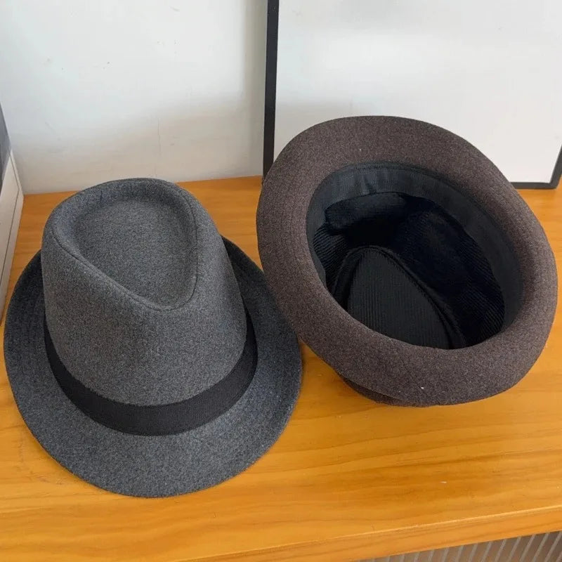 Charcoal Whispers Fedora paired with formal attire, showcasing its adaptability for any event.