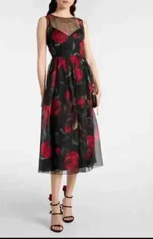 Midnight Floral Silk Dress on a hanger, showcasing its elegant drape and vibrant colors.