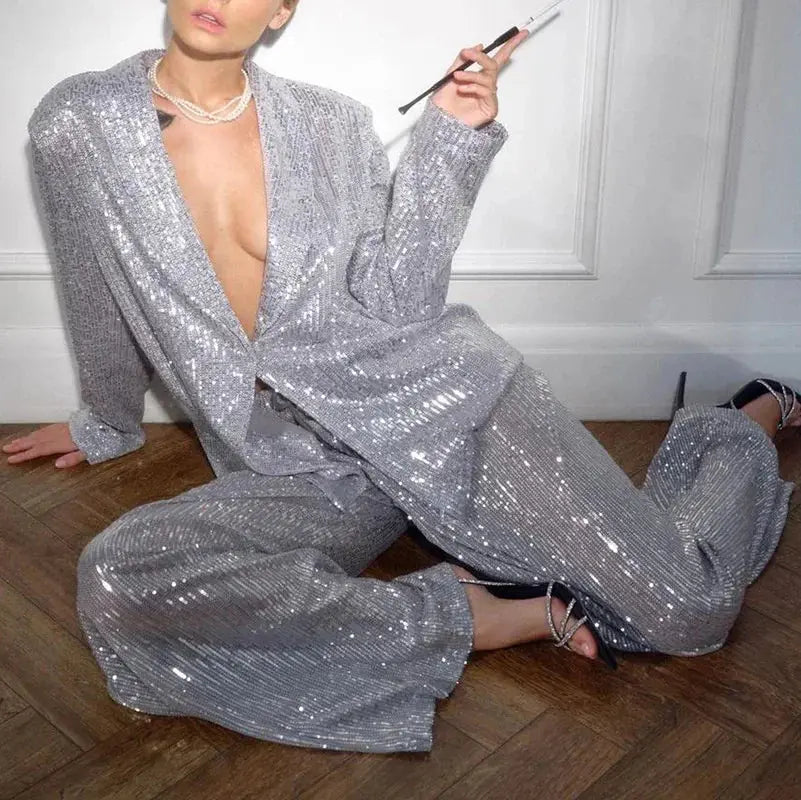 Dazzle Effortlessly sequin suit set in shimmering silver, perfect for any occasion.