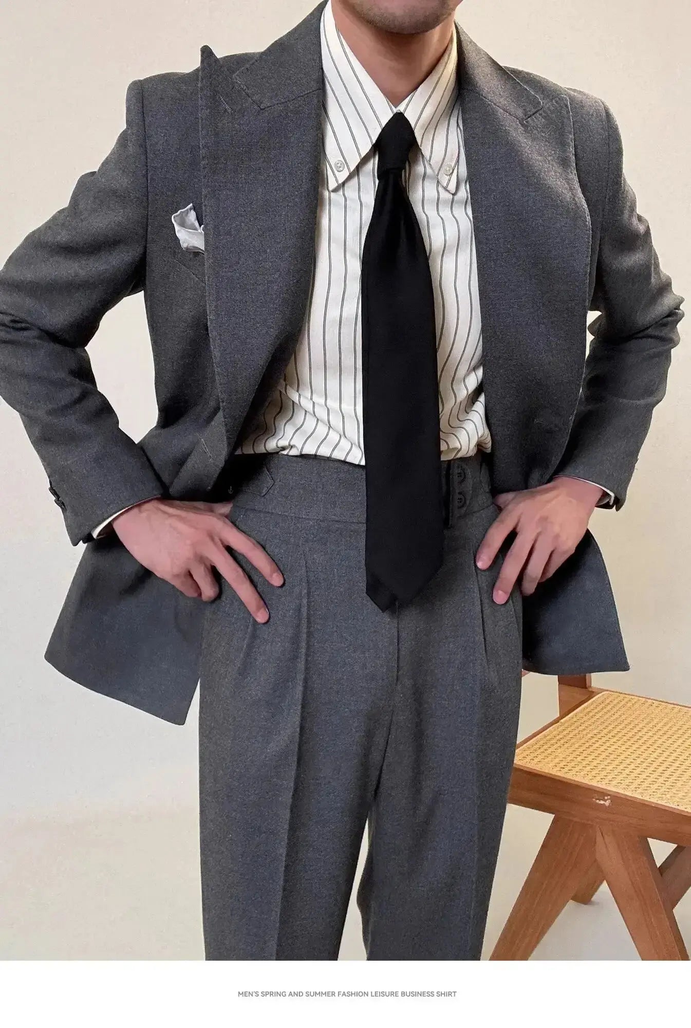Close-up of the tailored fit of the men's power suit, emphasizing a slim silhouette and professional look.