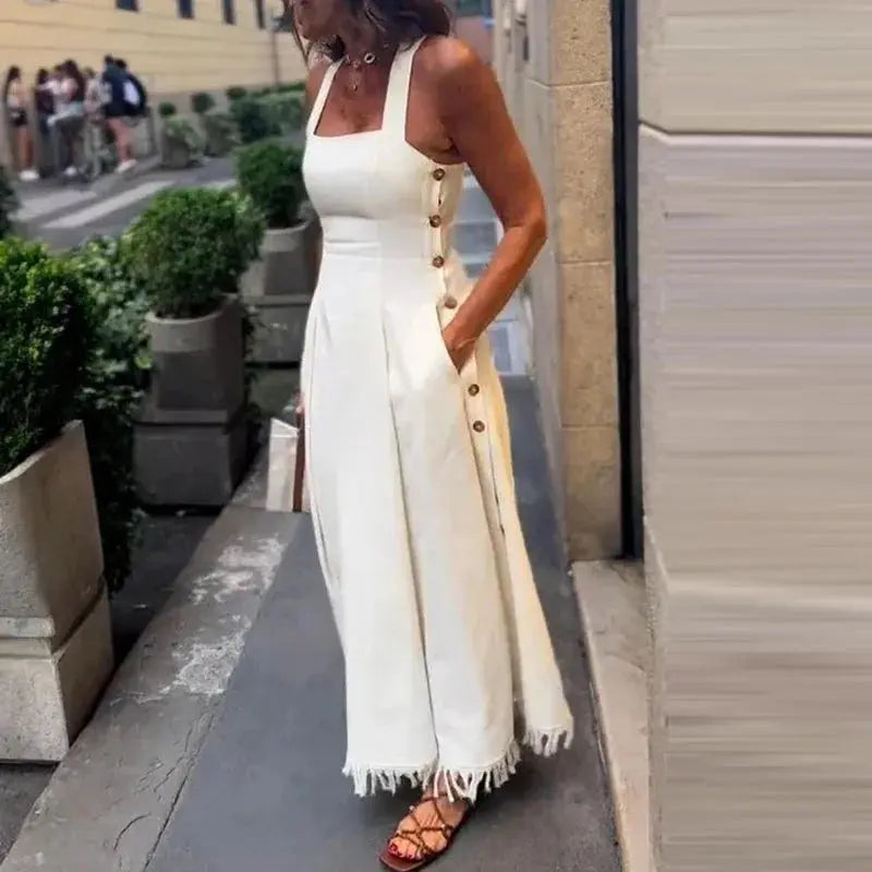 Model wearing the Summer Breeze Off-Shoulder Dress with practical side pockets and natural waistline.