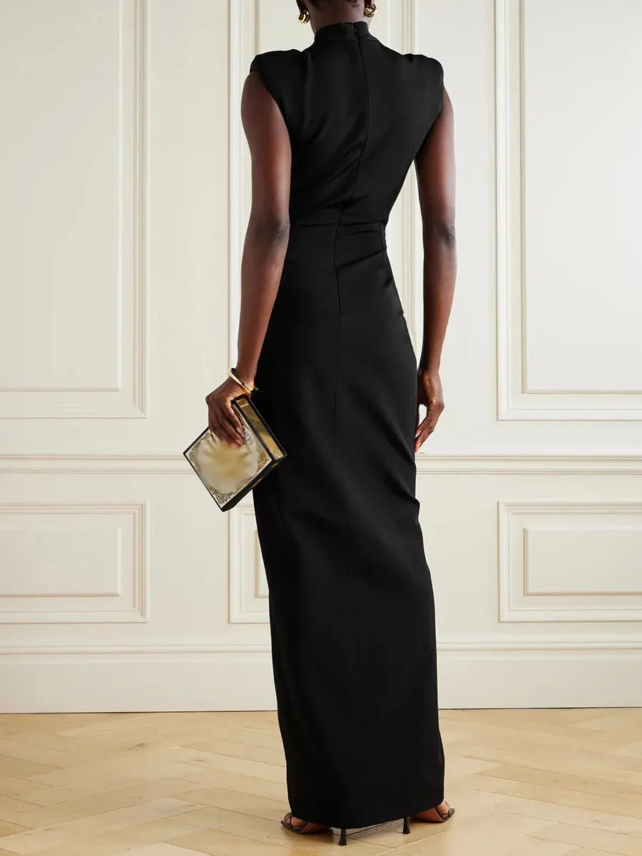 Close-up of the adjustable zipper slit on a stunning empire waist gown in luxurious fabric.