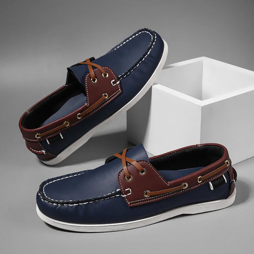 Side view of men's apron toe slip-on loafers showing cross-tied detailing and breathable construction