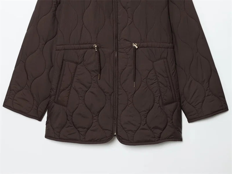 Versatile Autumn Whisper coat styled with casual jeans, showcasing its fashion-forward look.