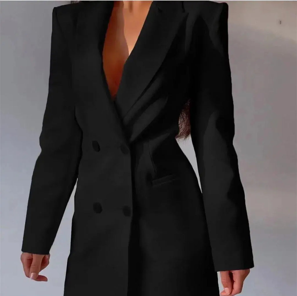 Close-up of the backless design of the black blazer dress, showcasing its daring elegance.