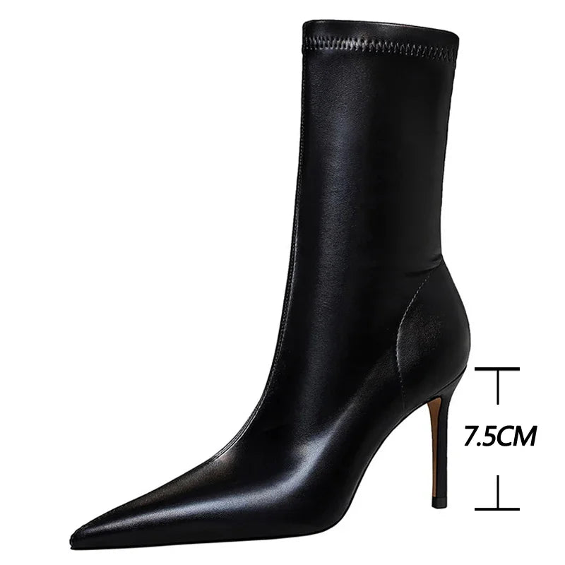 Sleek pointed toe boots in premium leather with mid-calf height