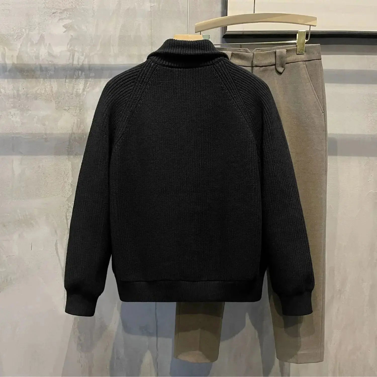 Model wearing the versatile men's sweater, showcasing its polished look.