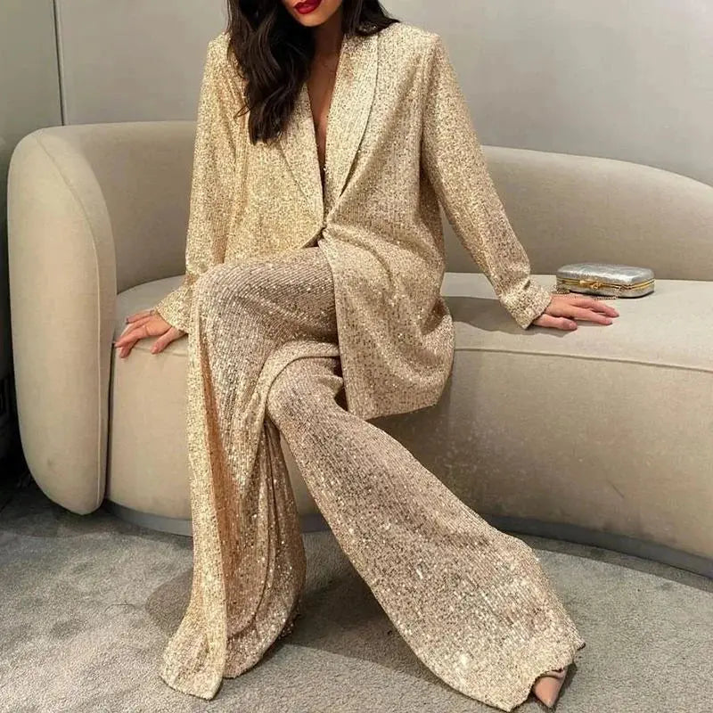 Woman transitioning from day to night in the Dazzle Effortlessly sequin suit set at an evening event.