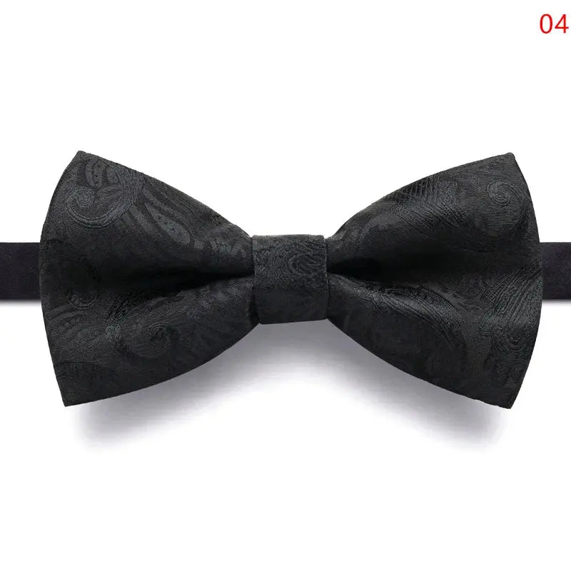 Black bow tie laid flat, emphasizing its durable polyester fabric and easy maintenance.