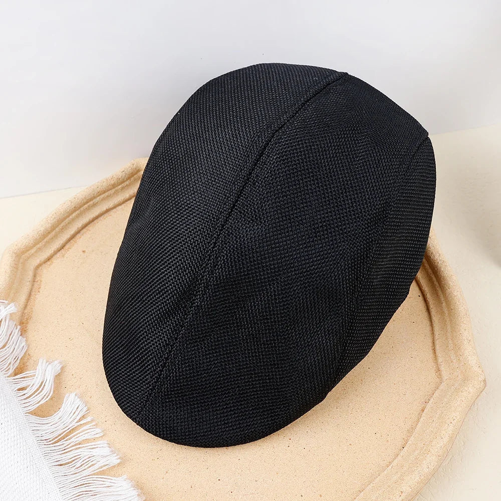 Tailored peaked beret in soft cotton denim displaying timeless elegance