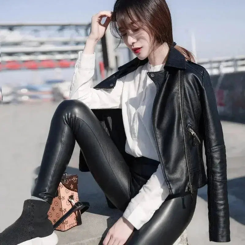 Back view of the leather jacket, emphasizing its sleek design and comfortable fit for modern women.