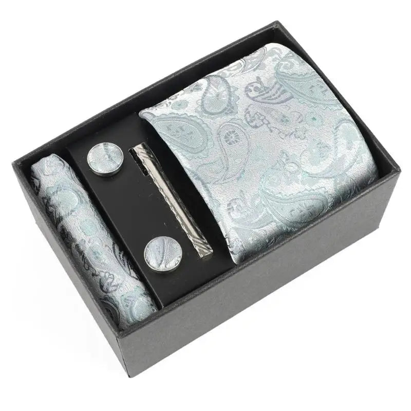 Stylish cufflinks and tie clip set, ideal for formal wear.