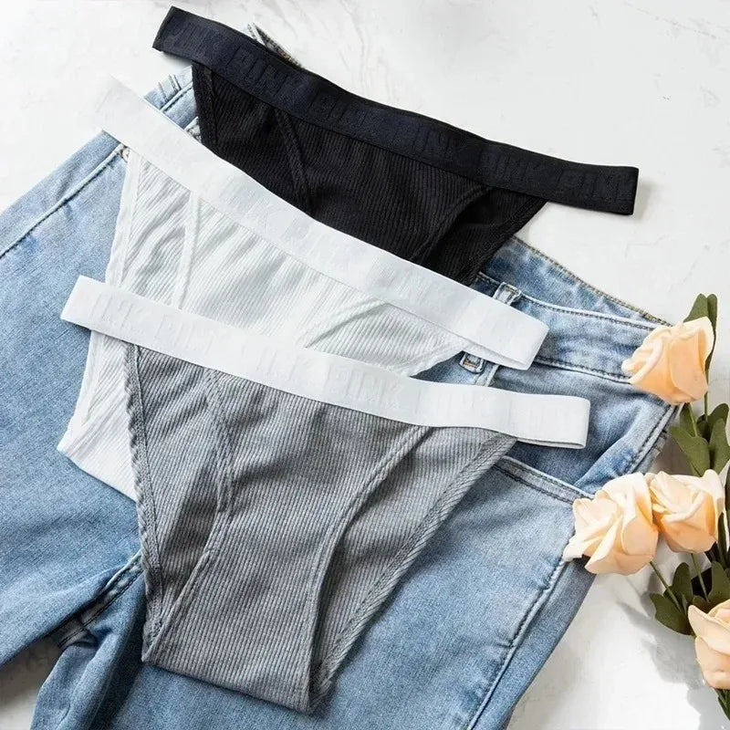 Low-rise brief underwear sitting at hip level on model showing seamless construction