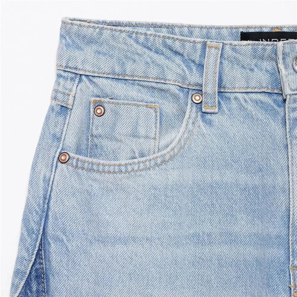 Close-up of splicing detail on Sunset Boulevard Wide-Leg Jeans in denim fabric.