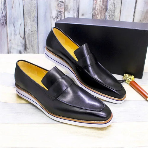 Professional men's leather loafers with durable rubber sole and breathable leather lining for boardroom wear