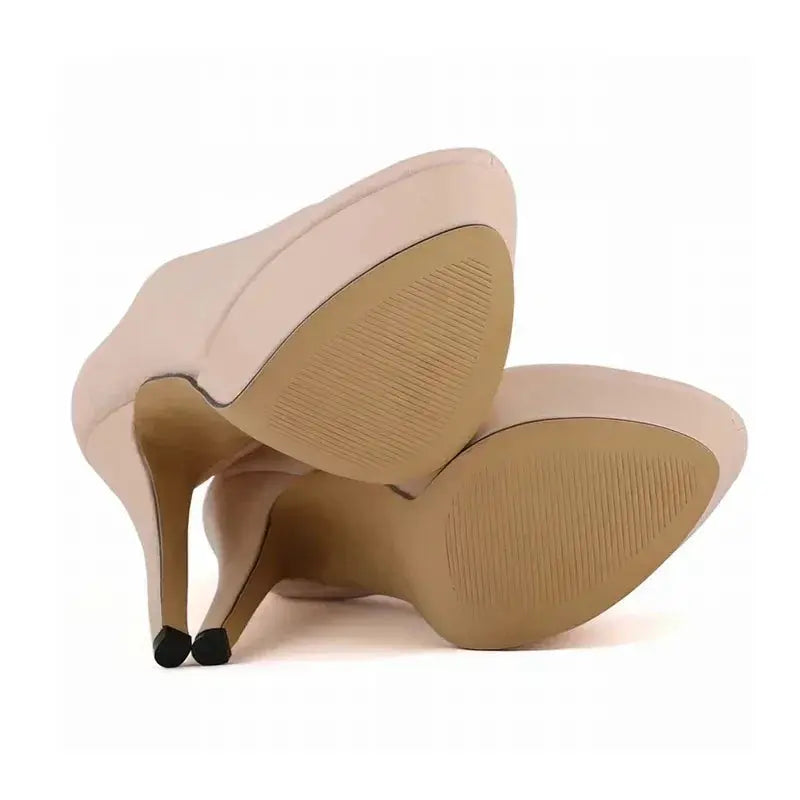Back view of durable leather pumps with a towering heel.
