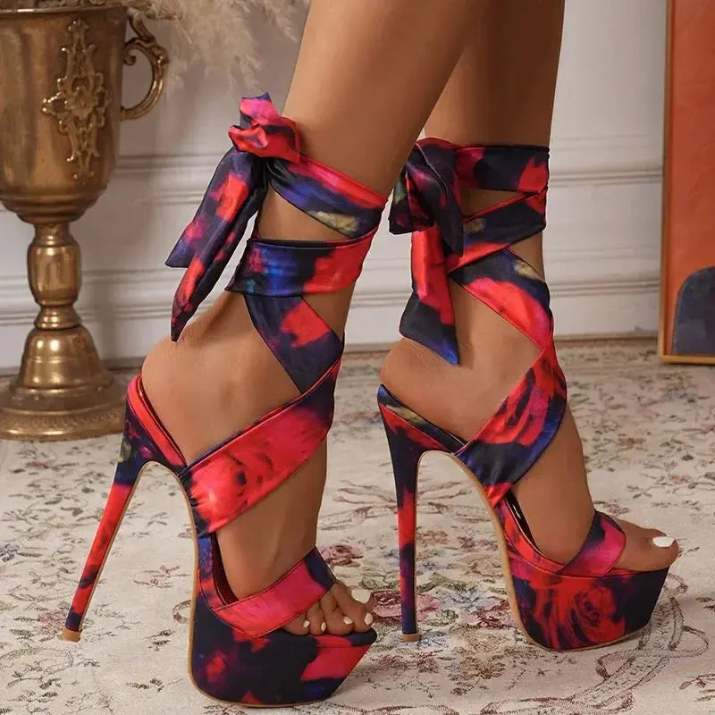 Elegant red high heels featuring a slim heel and cushioned insoles for all-night comfort.