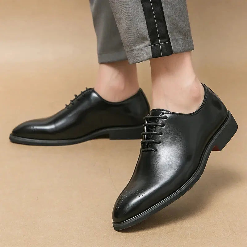 Lace-up design of men's leather oxfords showcasing sleek silhouette.