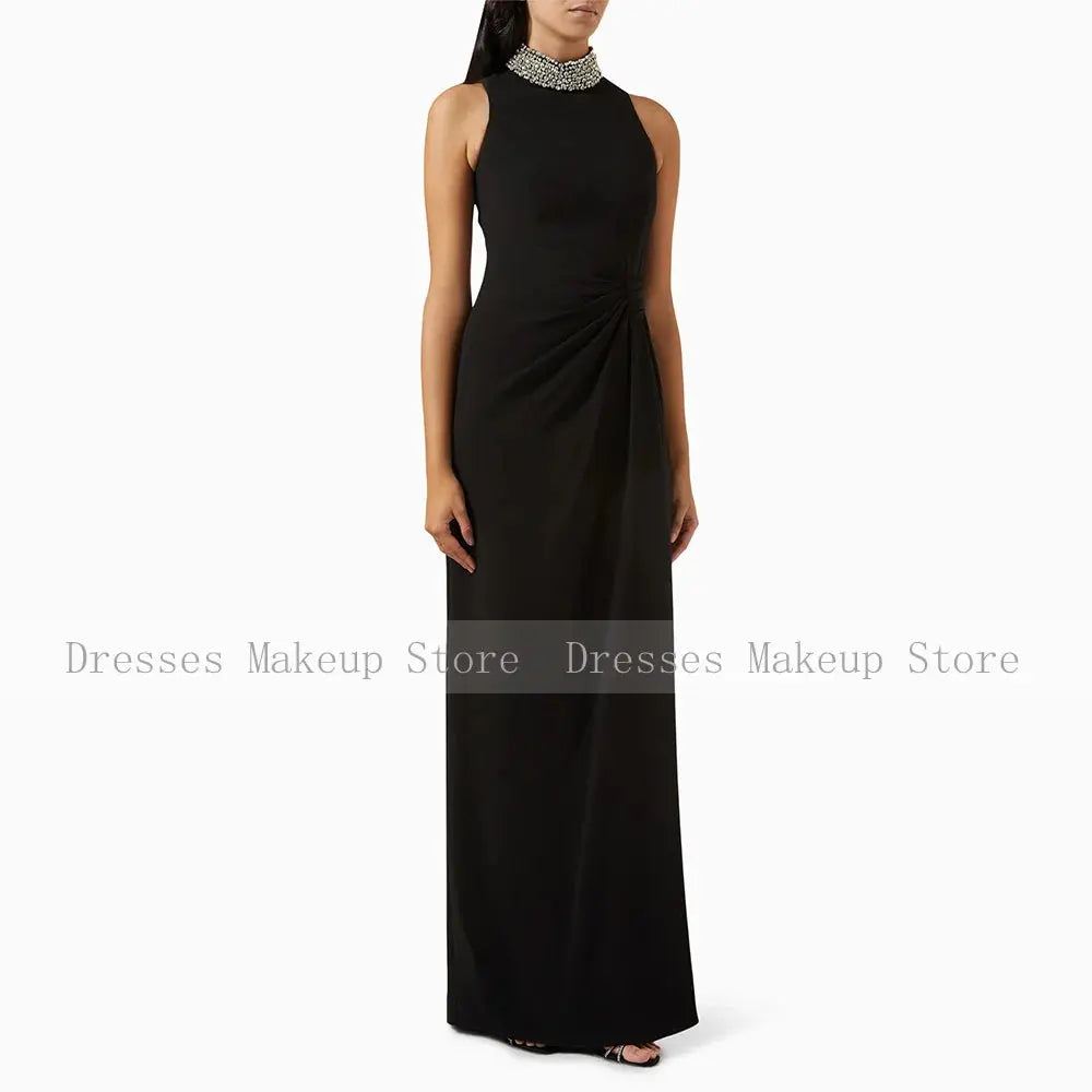Floor-length Midnight Sparkle Gown showcasing sparkling crystals, perfect for formal events and galas.