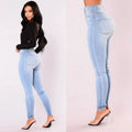 Flat lay of Contour High-Waist Jeans with accessories, showcasing versatile fashion options.